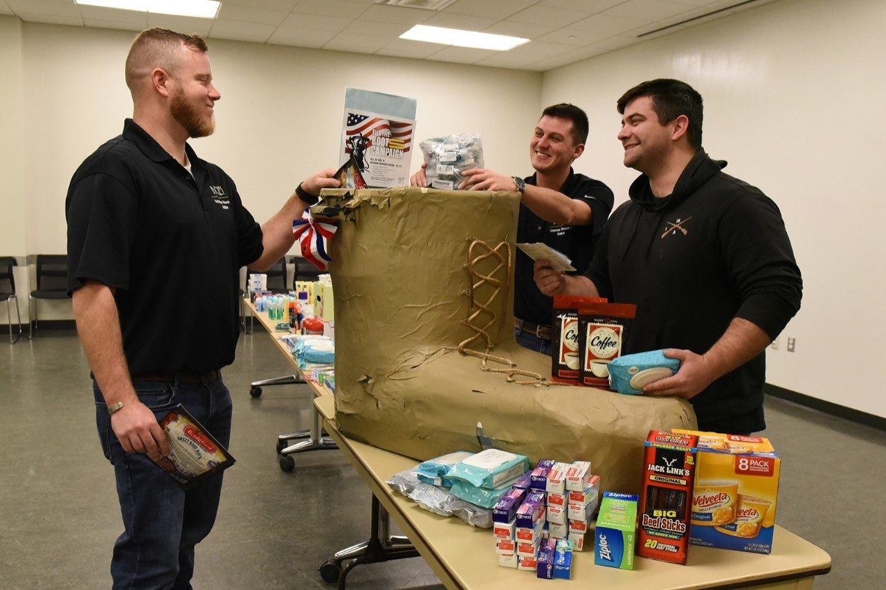 Travis Roy and other Veteran station employees