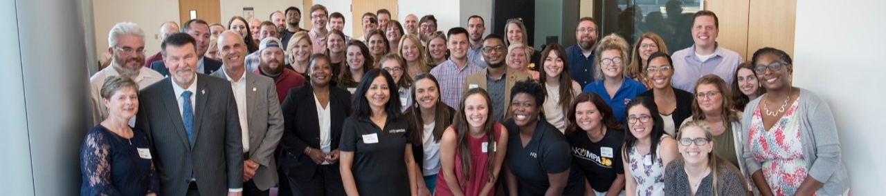MPA faculty and students in group photo at 30th anniversary reception