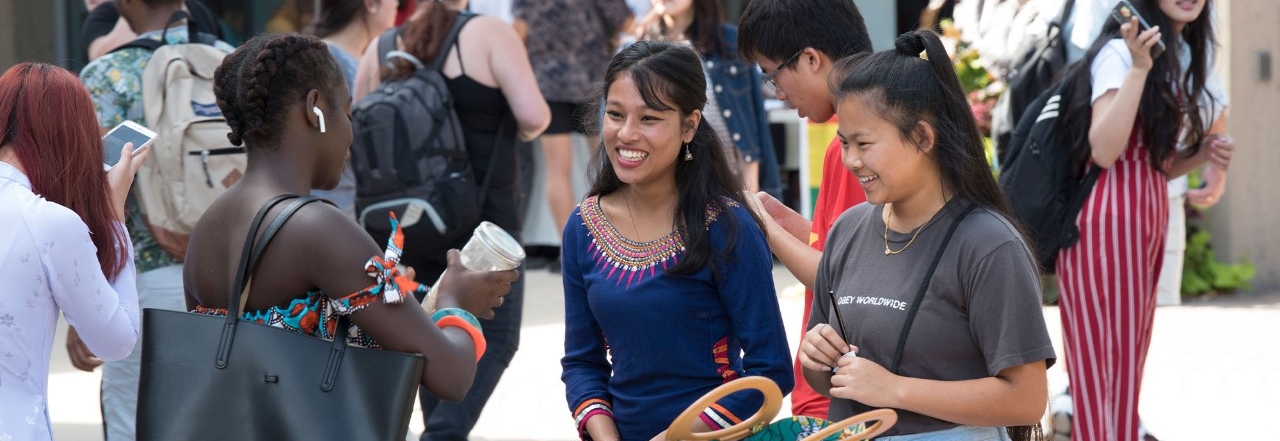 International students talking in a group outside at NKU